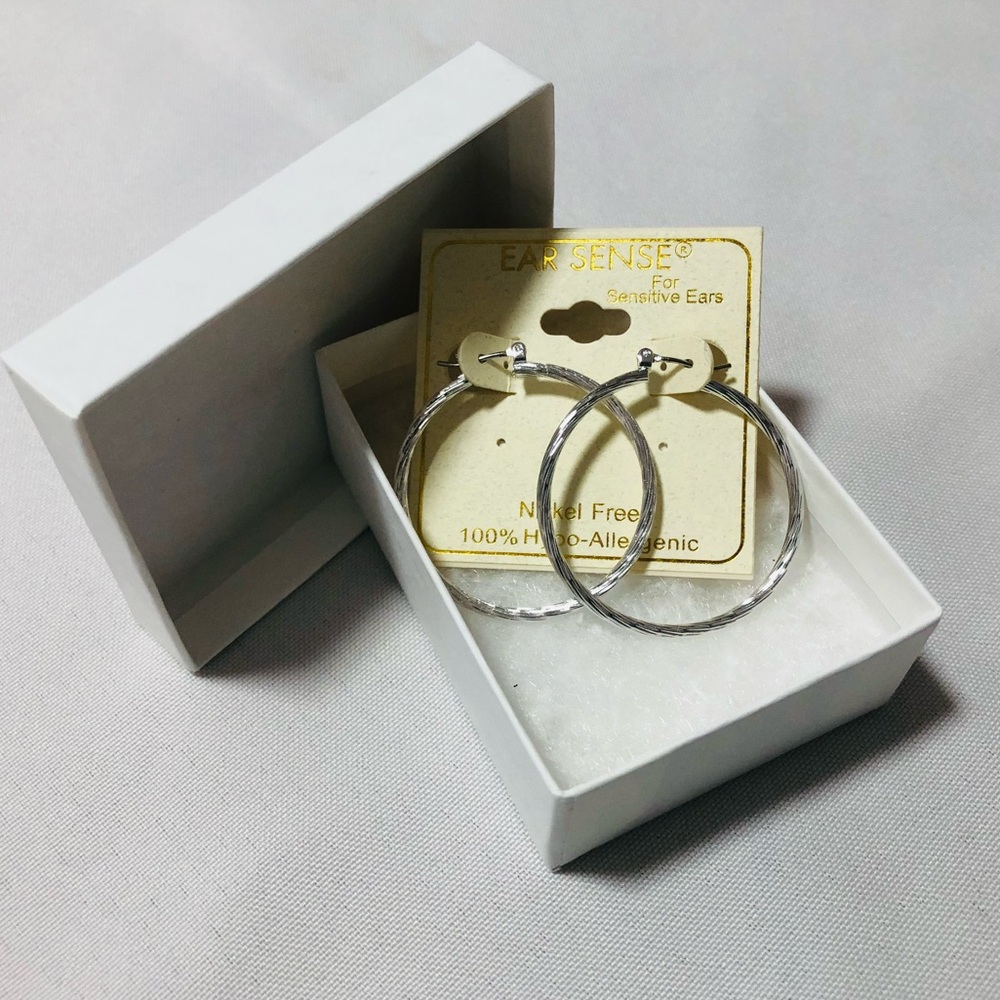 New Ear Sense silver hoop earrings